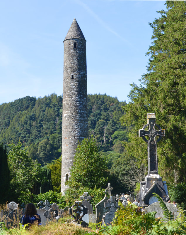 Glendalough round tower and celtic cross